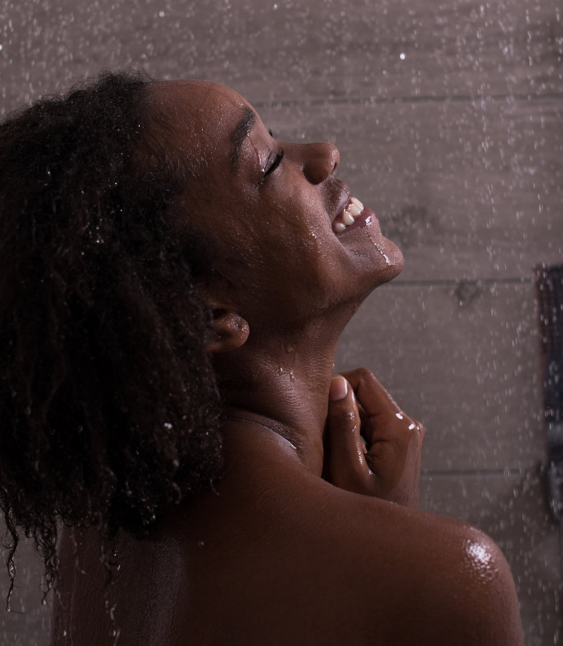 A woman taking a exilarating self care shower. Cherish U®