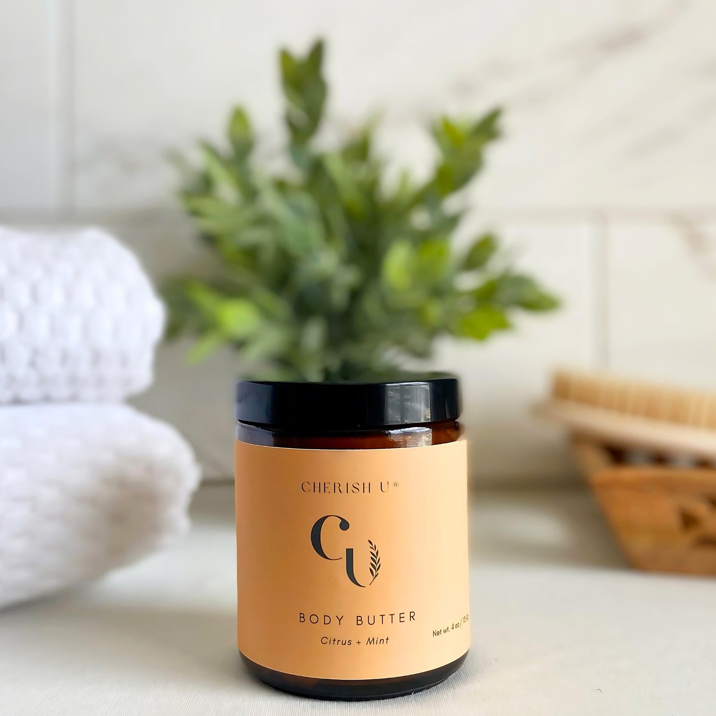 Amber jar of Citrus Mint Body Butter, designed to refresh and revitalize the skin with citrus and mint essential oils. Cherish U®