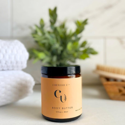 Amber jar of Citrus Mint Body Butter, designed to refresh and revitalize the skin with citrus and mint essential oils. Cherish U®