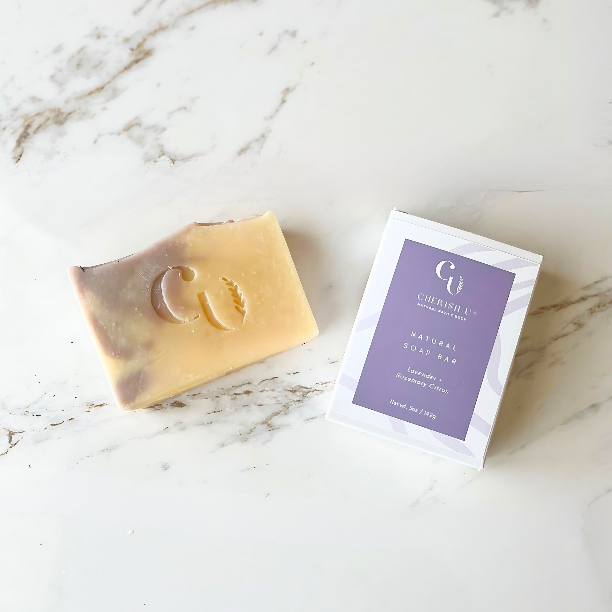 All-natural Lavender + Rosemary Citrus Soap with a refreshing and calming scent, made with pure essential oils for a luxurious cleanse.