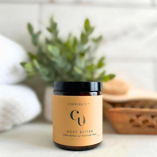 Amber jar of Triple Butter Body Butter with Colloidal Oats, designed to nourish and soothe dry skin with shea, mango, cocoa butter, and oats Cherish U®