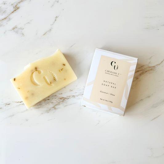 All-natural Coconut Shea Soap, a hydrating blend of coconut oil and shea butter, designed to moisturize and nourish dry skin. Cherish U®