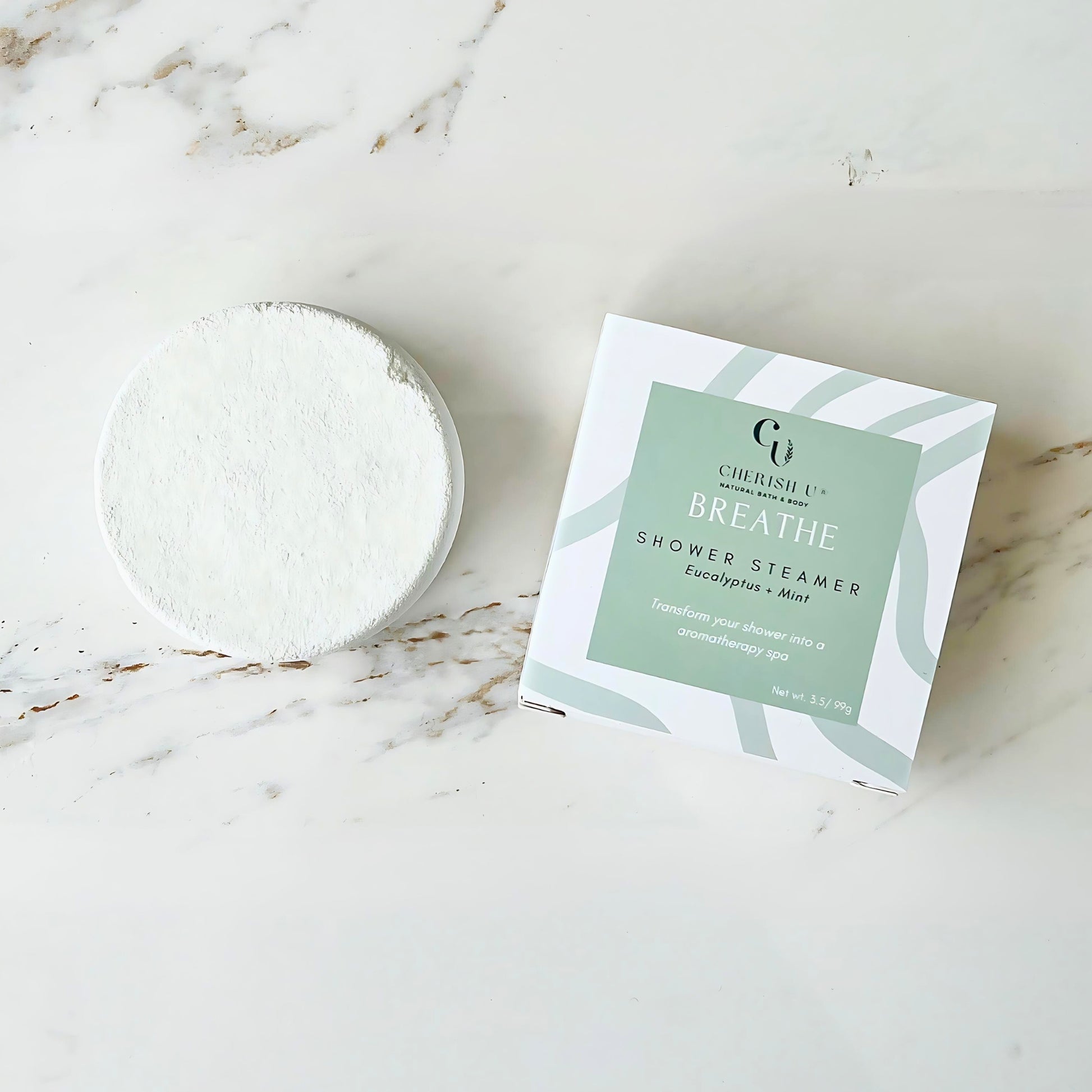 Eucalyptus + Mint Shower Steamer, a natural tablet designed to release refreshing eucalyptus and mint aromas for a revitalizing shower experience.