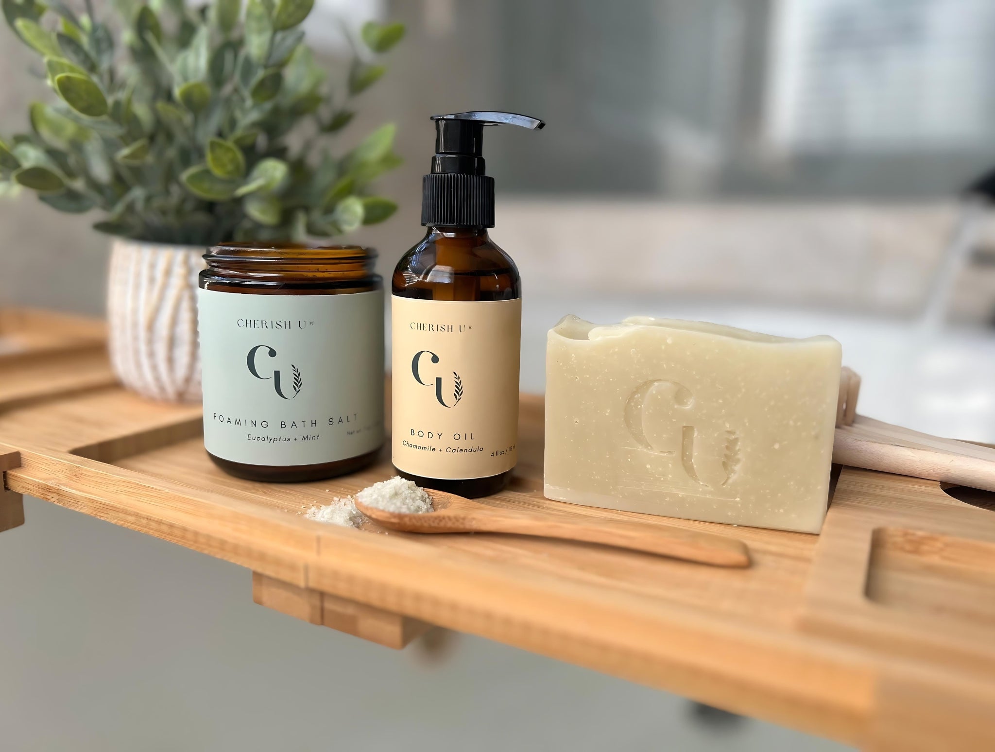 Spa bath set displayed on top of a wooden bath tray with runner tub water in the background setting the scene for a relaxing bath treat