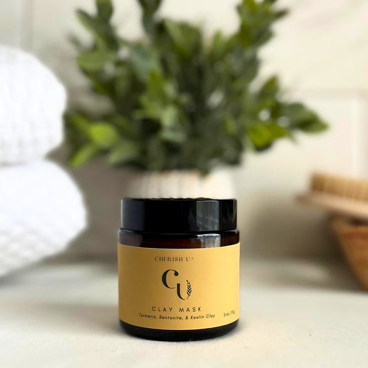 Amber jar of Turmeric & Kaolin Clay Mask, designed to brighten and detoxify the skin with turmeric and kaolin clay. Cherish U®