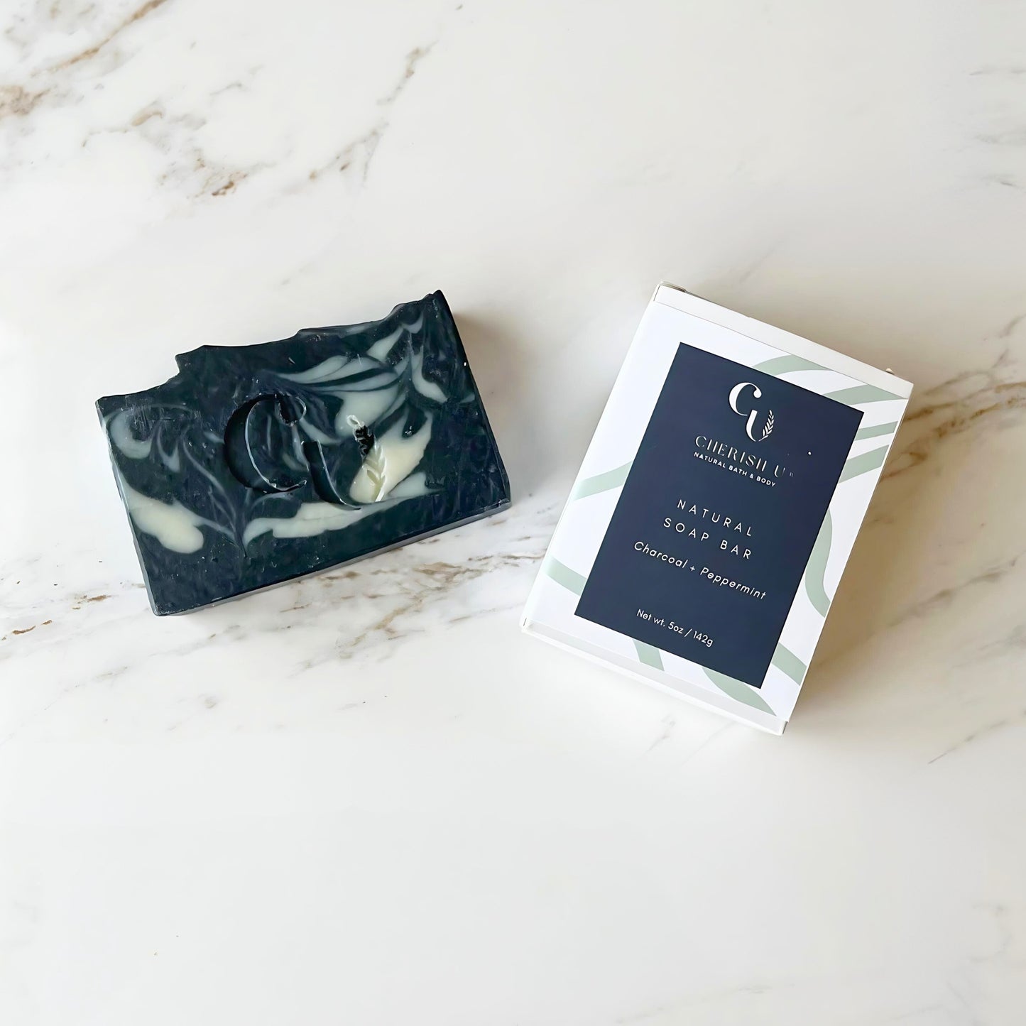 All-natural Charcoal + Peppermint Soap, perfect for deep cleansing and invigorating the skin with activated charcoal and refreshing peppermint oil. Cherish U®