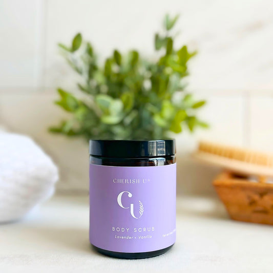 Amber jar of Lavender + Vanilla Sugar Scrub, designed to exfoliate and soothe the skin with calming lavender and warm vanilla fragrances Cherish U®