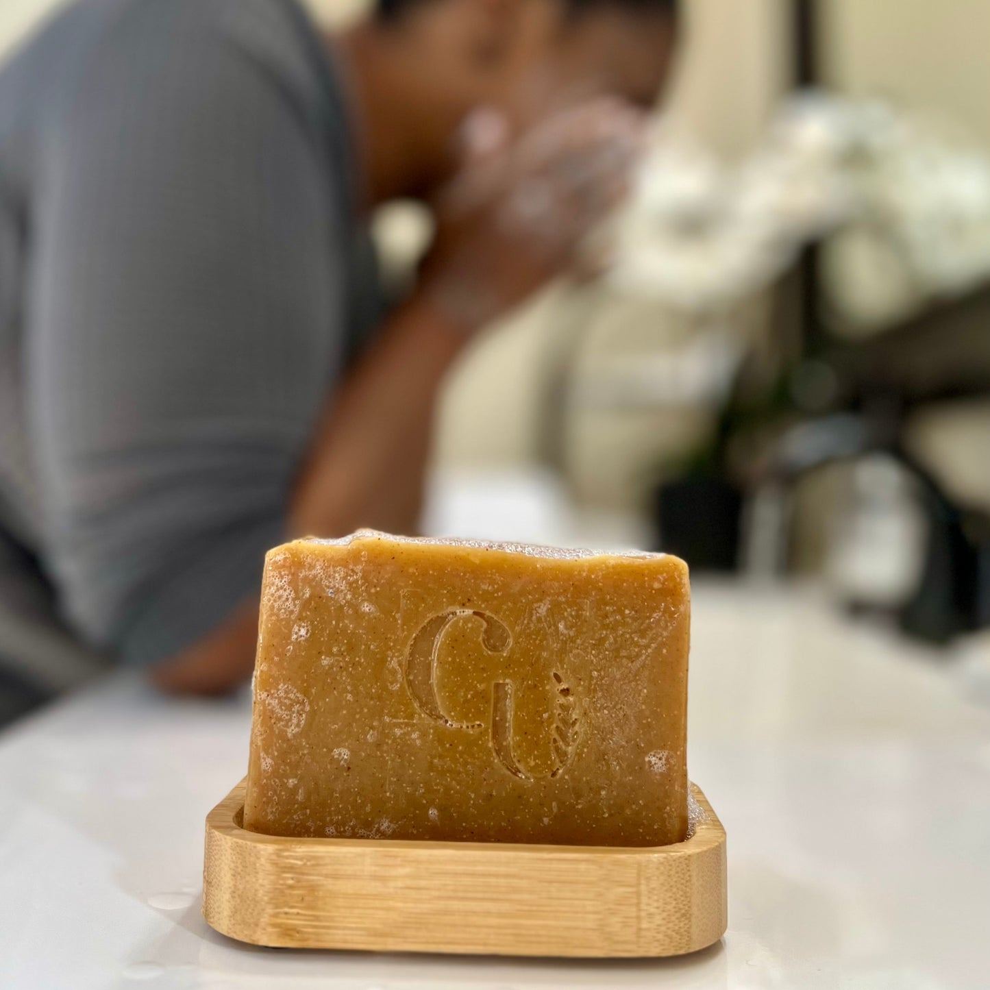 Face washing with turmeric soap, reveling in its antioxidant-rich properties and warm, spicy aroma."ace + Body Bar Cherish U®