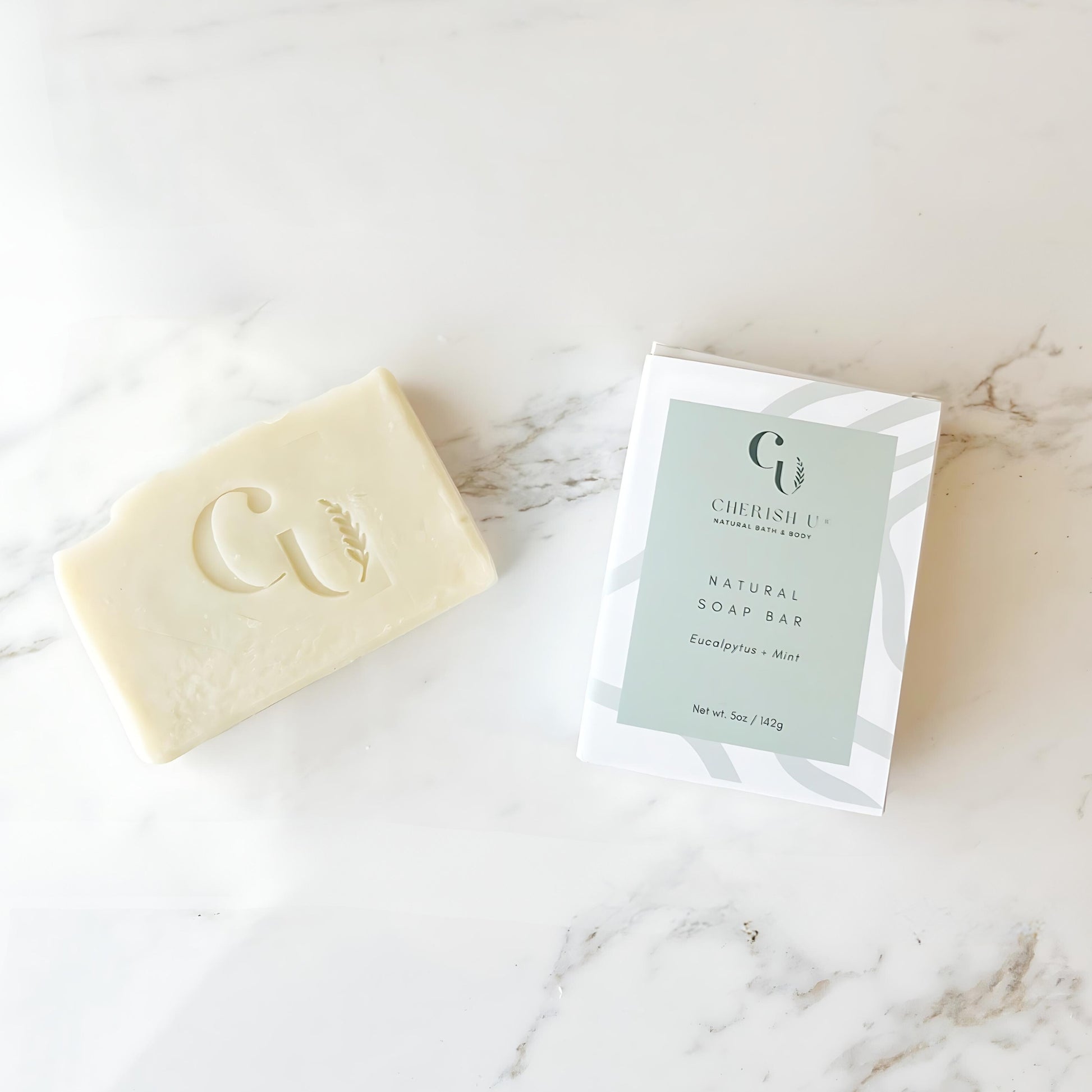 All-natural Eucalyptus + Mint Soap, infused with invigorating eucalyptus and refreshing mint essential oils, designed to cleanse and revitalize the skin.
