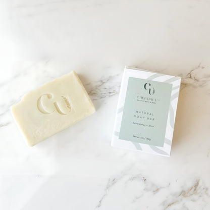 All-natural Eucalyptus + Mint Soap, infused with invigorating eucalyptus and refreshing mint essential oils, designed to cleanse and revitalize the skin.