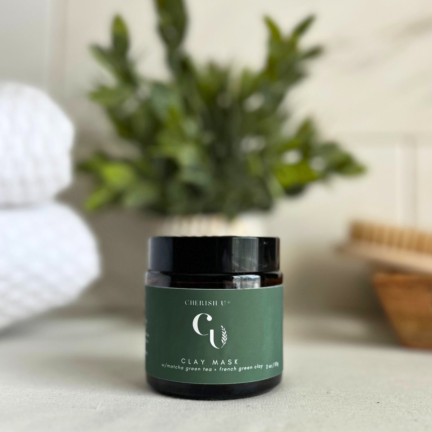 Amber jar of Matcha Green Tea + French Green Clay Mask, designed to detoxify and rejuvenate the skin with matcha green tea and French green clay Cherish U®