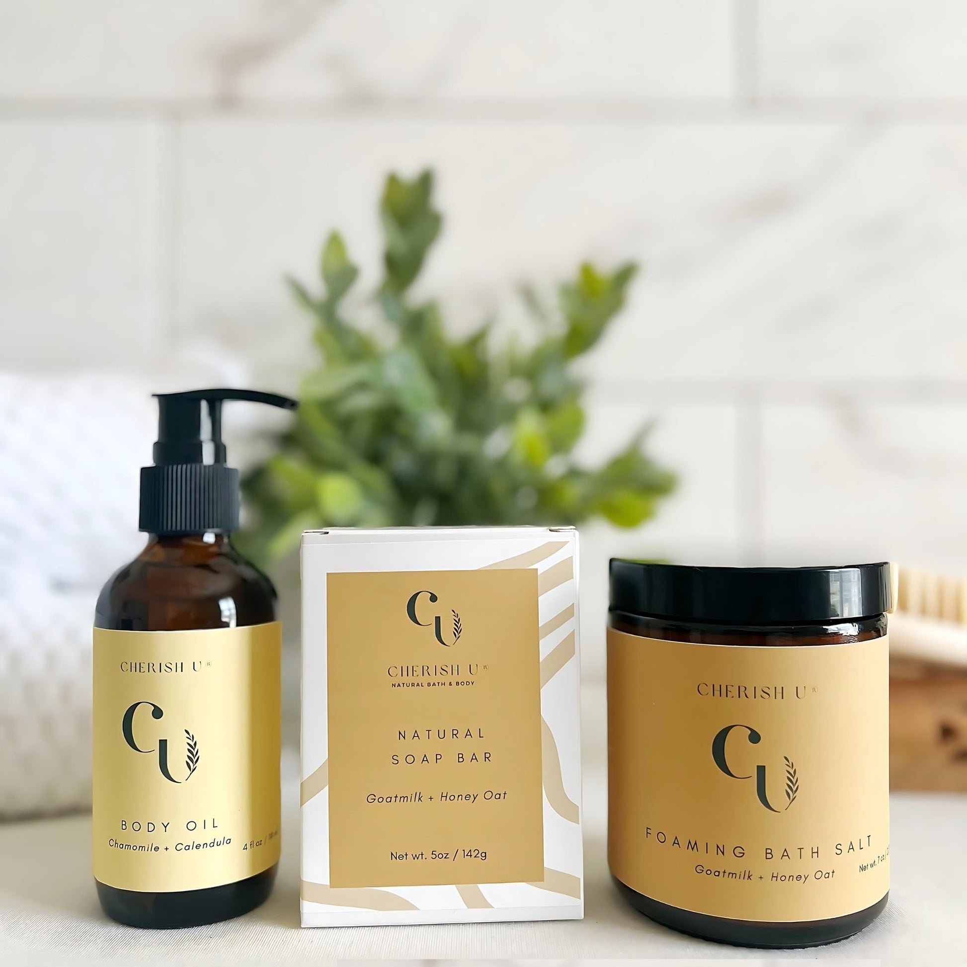 Amber jars and bottles of the Nourish Spa Bath Set, including Goat Milk + Honey Oat Soap, Foaming Bath Salt, and Chamomile + Calendula Body Oil, displayed with a soothing ambiance for ultimate skin nourishment.