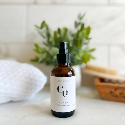 All-natural Rosewater + Aloe Facial Toner in a amber bottle, designed to soothe, hydrate, and balance the skin for a refreshing skincare experience.